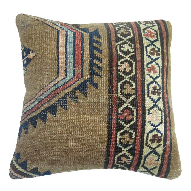 Pillow made from an early 20th century Persian Bakshaish rug. Measures: 17” x 18”.