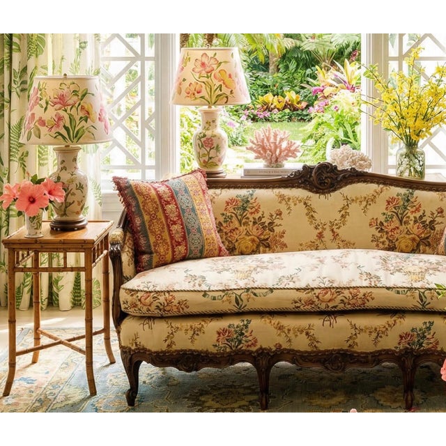 Elegant Louis XV style carved walnut sofa newly upholstered in luxurious French linen with a plush down-filled seat...