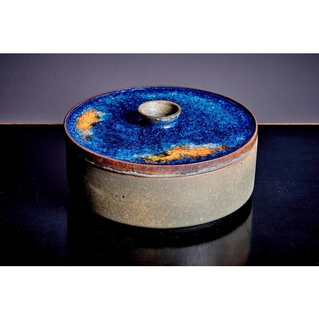 Nice pair of 1960s Majolika ceramics, known for bold glazes and artistic designs. The larger lidded container has a...