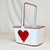 Fun little white metal basket with red piping and a satin ribbon Heart, perfect to collect your Valentine cards. With...