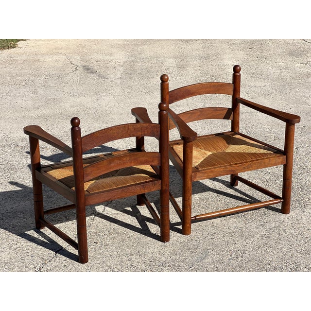 Pair of wood and straw armchairs, French work circa 1960. Removable straw seats in very good condition. Wooden frame in...