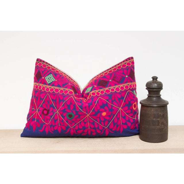 A lovely hand-embroidered pillow made from vibrant vintage tribal skirts coupled with a new linen back. This intricate...