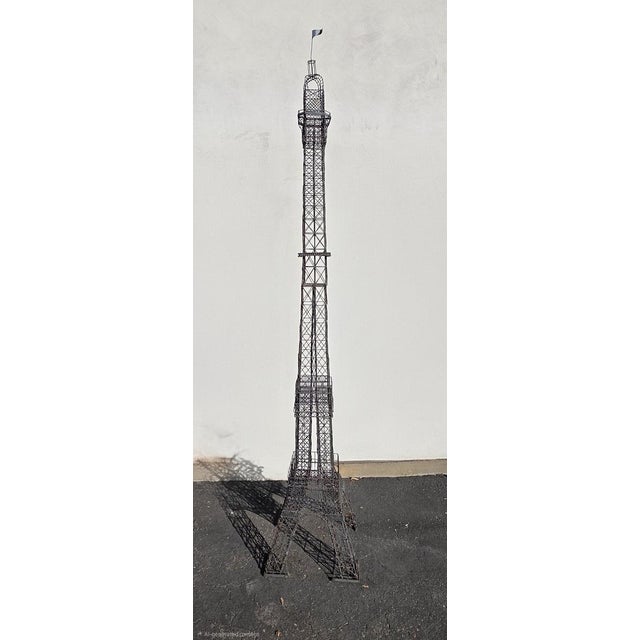 Eiffel Tower sculpture custom made by family member and used inside their family clothing and antique store. Stands 111 in...