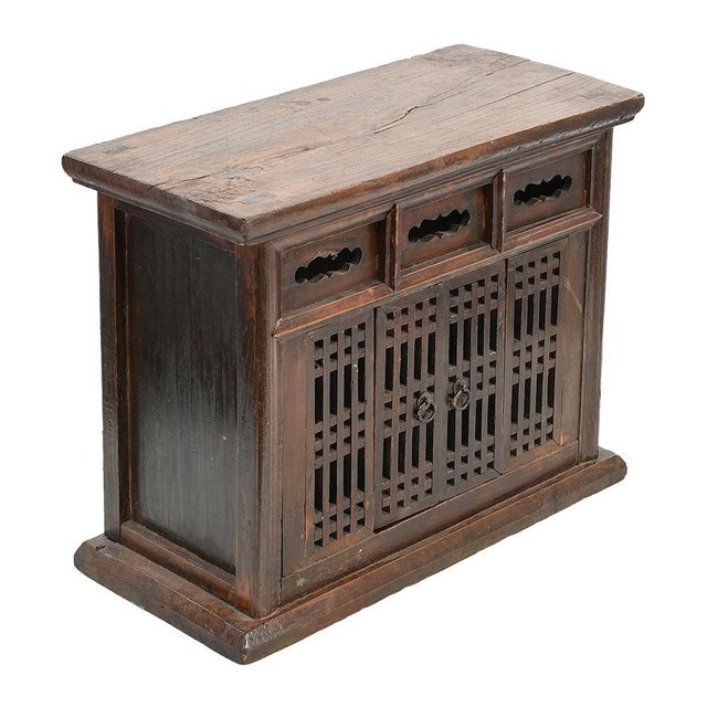 This charming little piece of traditional Asian furniture offers a captivating blend of craftsmanship and functionality....