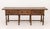Spanish Baroque-Style Walnut Console Table, with three drawers on eight turned wood legs conjoined by center stretcher....