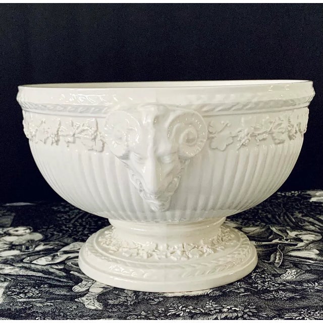 Vintage circa late 1940s Wedgwood pedestal centerpiece bowl featuring elegant ram’s head handles and refined embossed...