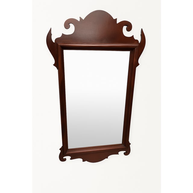 A beautifully crafted vintage Chippendale-style beveled wall mirror inspired by English Tudor and Colonial Revival...