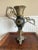 A 19th-century Rococo Style Figural Neptune Mantel Vase / Urn manufactured by Bradley & Hubbard Manufacturing Company....