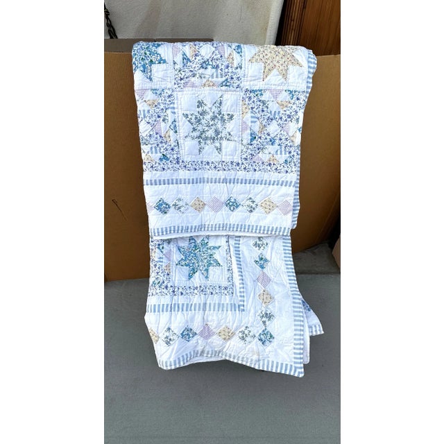 Vintage quilt that will add some summery farmhouse flair to your bedding. Quilt is designed in a star pattern variation,...