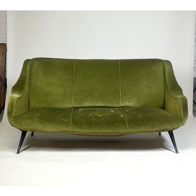 Vintage Italian 3 seat sofa from the 1960s, designed with the generous proportions and curved armrests characteristic of...