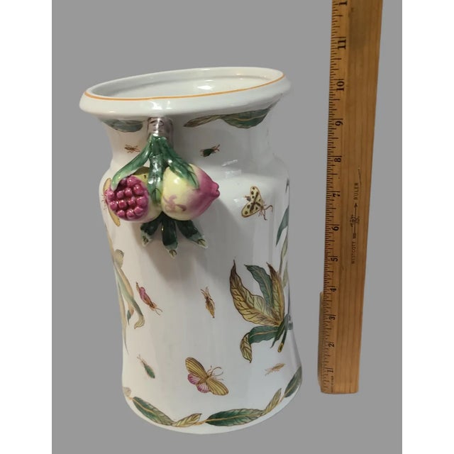 This beautiful Asian vase is a true work of art. Handmade and hand painted, it features delicate butterfly designs and...