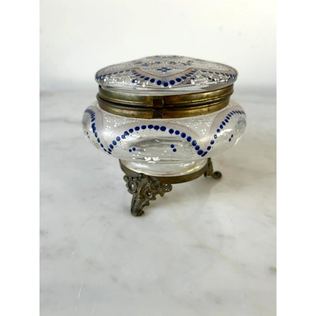 This exquisite Moser enameled glass dresser box, originating from Austria in the late 19th century, showcases the skilled...