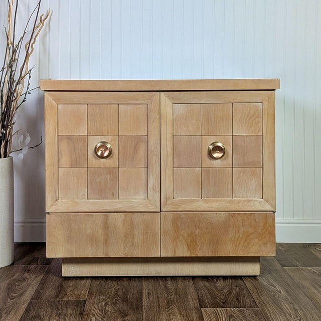 Vintage MCM cabinet with atomic starburst hardware. Features upper cabinets with pull-out trays that can be used for...