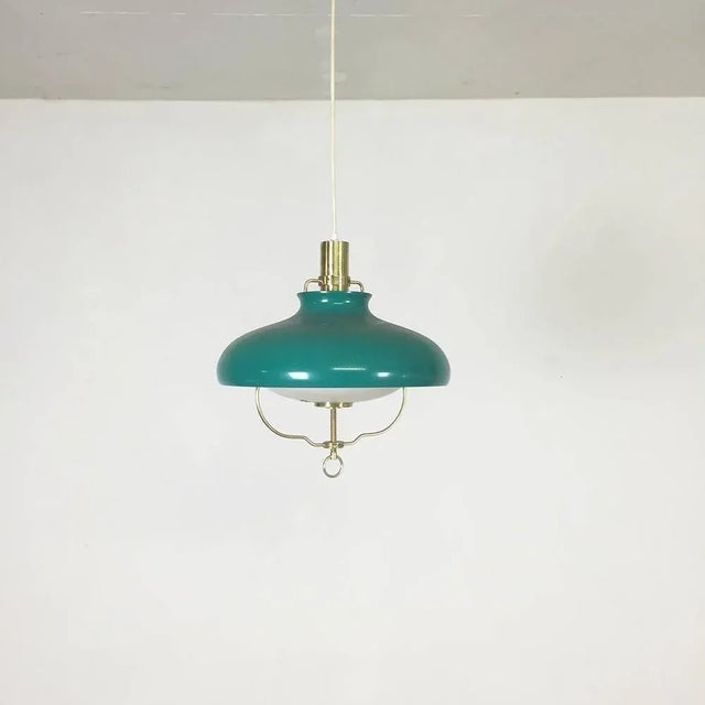 Green hanging light Made by Lyfa, Denmark, 1960s. This hanging light was produced by Lyfa, Denmark in the 1960s. The lamp...