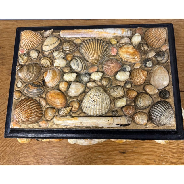 This vintage folk art seashell-encrusted hinged top box is a treasure from the shores of imagination, where careful hands...