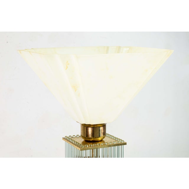 A pair of 1960s Gaetano Sciolari brass and glass cane table lamps. This extraordinary set of table lamps feature a...
