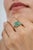 This 1.58 carat emerald cluster ring is crafted in 925 sterling silver and features an octagon cut emerald surrounded by...