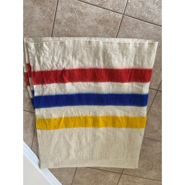 Vintage Hudson Bay Style Midcentury White With Red, Blue, and Yellow Striped Wool Blanket For Sale - Image 9 of 10