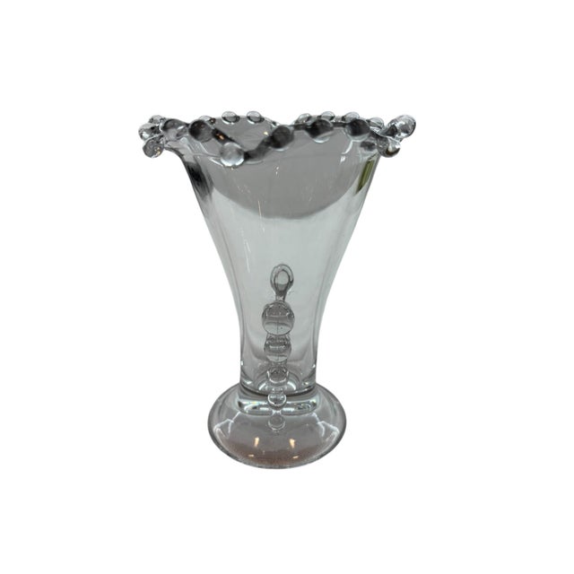 This charming flower vas has crimped edging and charming details on the sides. Vase base measures 2.875"; opening of vase...