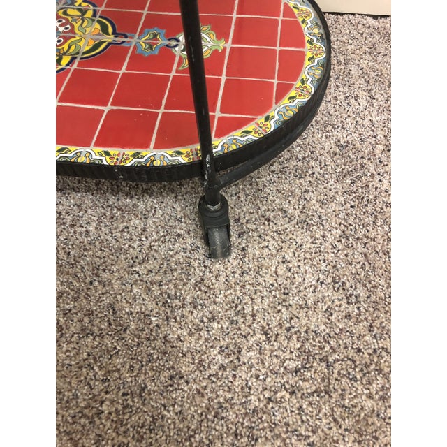 Vintage Three tiered rolling bar cart or serving cart with a beautiful vibrant red tiled top and bottom tier. Each with a...