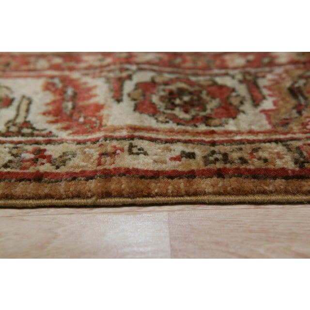 Giselle Zinnia Brown Hand Knotted Wool Rug, Country of Origin: China. This exquisite hand-knotted wool runner showcases...