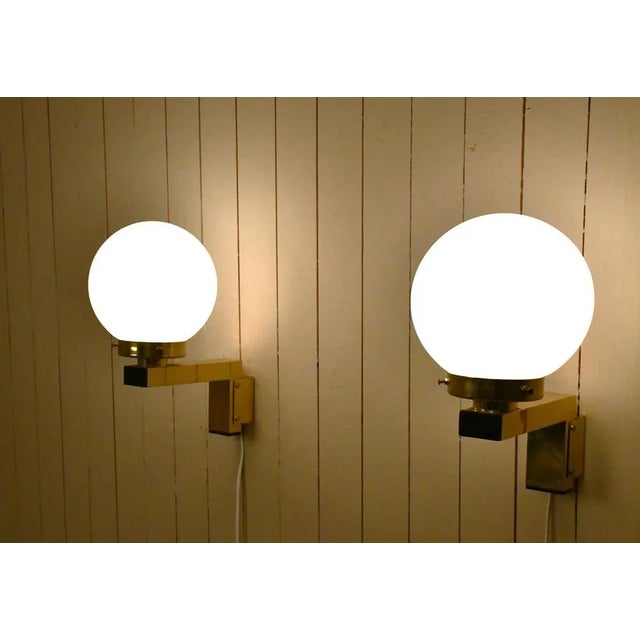 Swedish brass and opaque glass sconces, model v397, by hans-agne jakobsson for hans-agne jakobsson ab, 11 pair available....