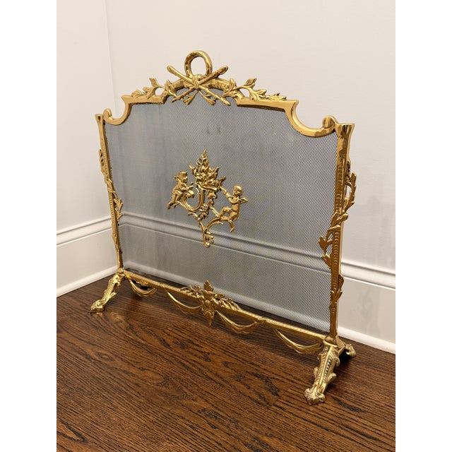 Elevate your hearth with this Louis XV–style brass fireplace screen, richly adorned with classical French Rococo motifs....