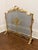 Elevate your hearth with this Louis XV–style brass fireplace screen, richly adorned with classical French Rococo motifs....