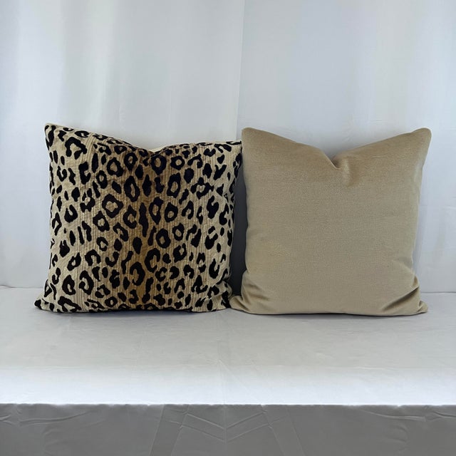 Custom-tailored 22” square feather/down velvet animal print pillows in shades of brown and tan. Solid tan velvet back....