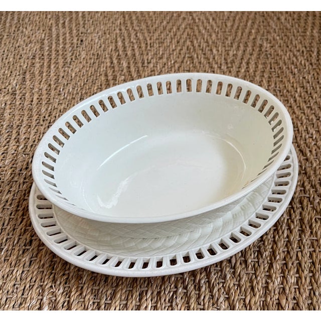 Gorgeous Creamware Wedgwood reticulated oval basket with matching underplate in the typical weave pattern by the English...