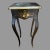 A French style side table features a lift top and tufted blue fabric interior, hand painted with multicolor floral...