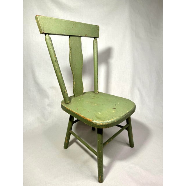 The patina and pistachio green color caught my eye on this petite sized chair! The fiddleback style has versatility and...