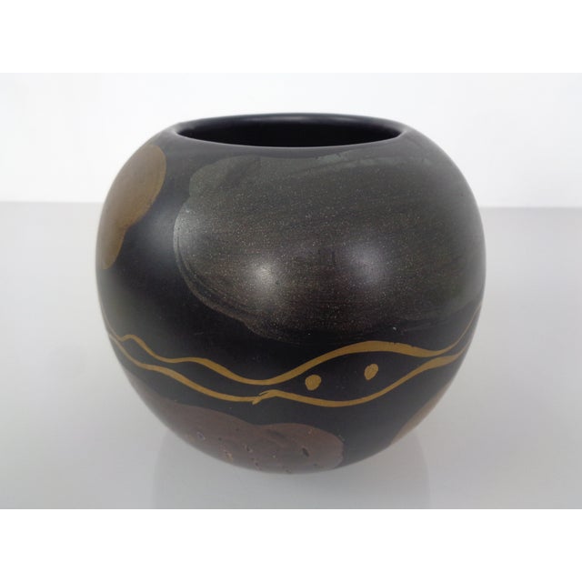 Studio ceramic vase from the 1970s. Hardly legible signature on the vase and marked 262 on the underside. Probably from...