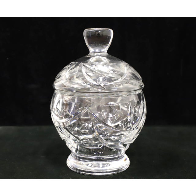 A Mid 20th Century crystal candy dish with lid. Clear crystal round bowl with a cut pattern. Matching clear crystal cut...