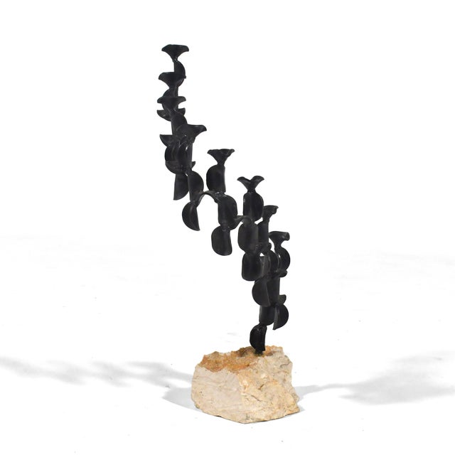 This beautiful candelabra by Israeli artist David Palombo can serve as a menorah at Hanukkah and a wonderful abstract...