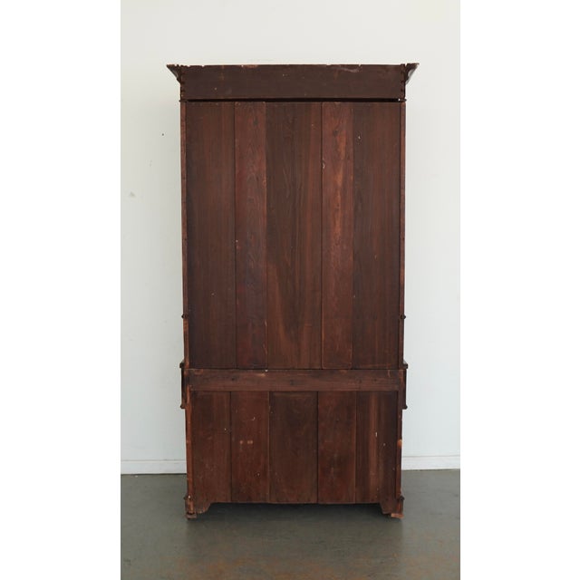 This antique Victorian secretary desk bookcase, dating to the late 19th century, is a beautifully crafted and highly...