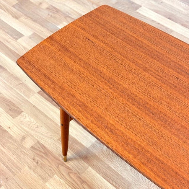 Coffee table was manufactured in Sweden in the 1950s-60s by Alberts, Tibro. It is made of teak veneer on the top surface...
