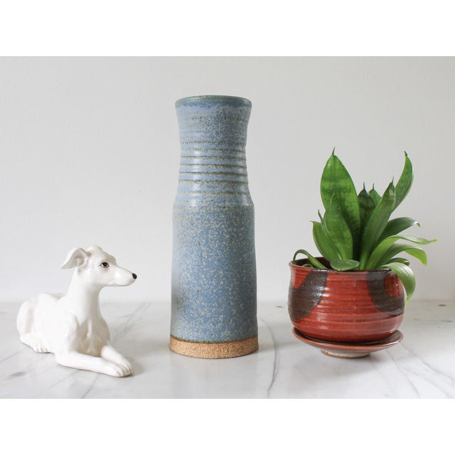 Vintage blue studio art pottery vase. Signed by artist on bottom. Minor age wear.