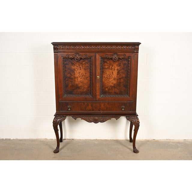 A gorgeous antique Chippendale or Georgian style bookcase, bar cabinet, or dining cabinet In the manner of Berkey & Gay...