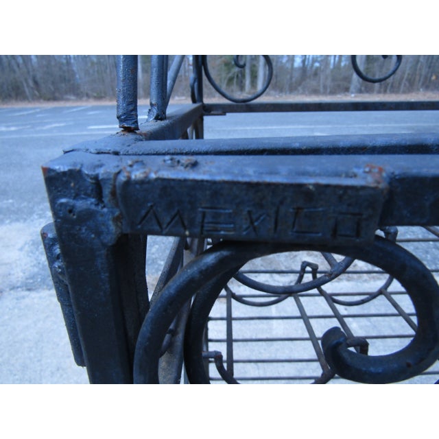 With curling metal accents and plenty of storage, this vintage wine rack is unique and functional. WEAR Wear consistent...