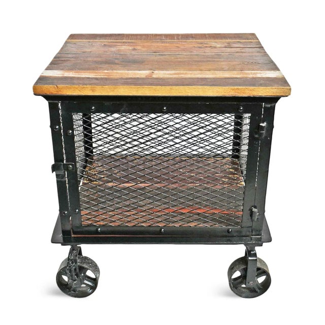 Industrial farmhouse style iron and rustic salvaged wood top side cabinet. Solid construction with iron caster wheels and...