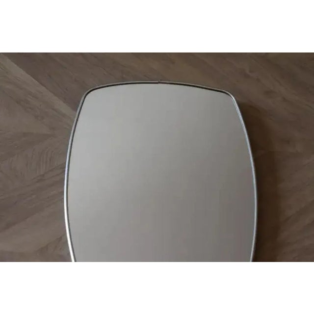 This very decorative mirror was made in Italy in 1960s. It is typical of this period design and is all original. It could...