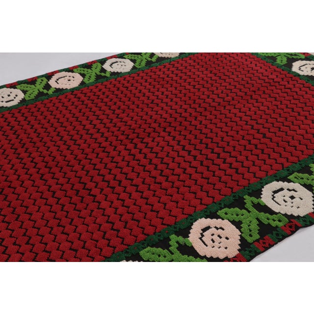 Hand-knotted in wool and originating from Turkey circa 1950-1960, this 7x10 vintage Tulu rug is an exceptional piece among...