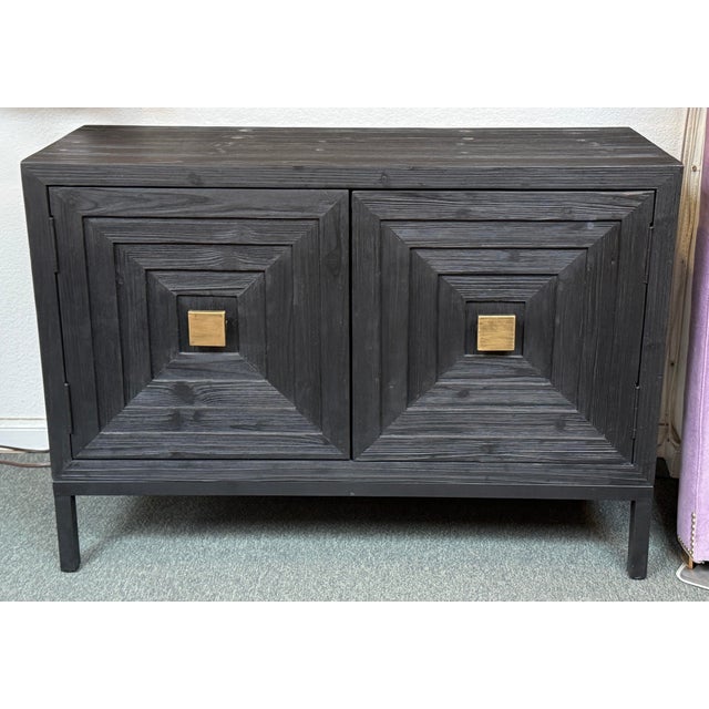 Design Plus Gallery presents the Aiken Cabinet from Uttermost. This cabinet takes on a rectangular shape and boasts a flat...