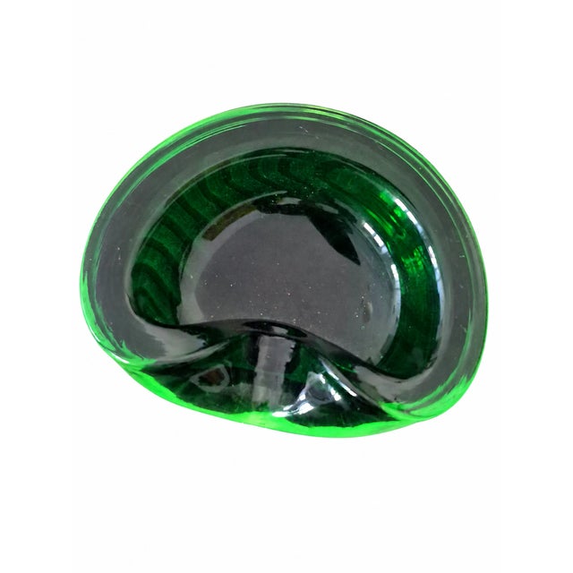 Beautiful, very well-preserved Murano glass ashtray from the 1960s. The green glass shifts slightly to black depending on...
