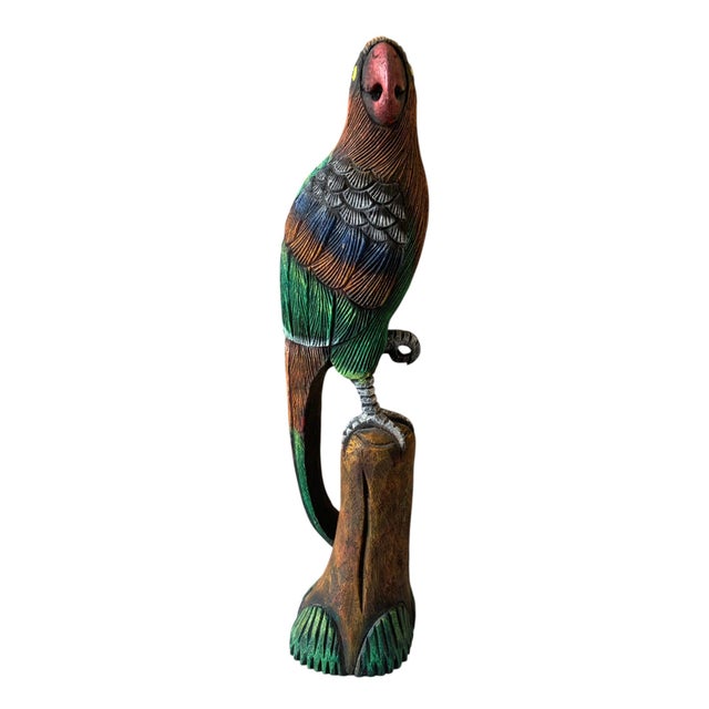 This beautiful vintage wooden hand-carved parrot stands 16.5 inches tall, showcasing intricate craftsmanship and vibrant...