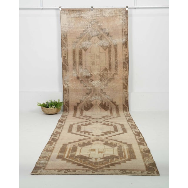 Vintage Turkish Hand-Knotted Runner rug is a semi-antique vintage runner rug. The '70s Eastern region of Anatolian's...
