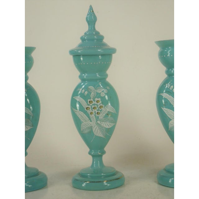This Victorian Beaux-Arts mantel 3-piece set of vases tributed to Bristol Glass features blue Opalescent floral Enamel in...