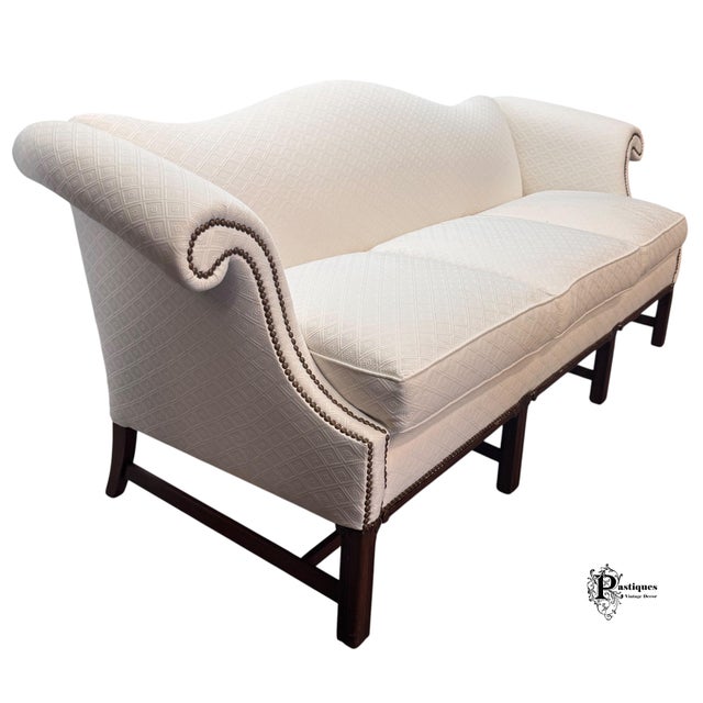 Vintage Chippendale Style Camel Back Sofa featuring Sturdy Hardwood Frame Construction, Elegantly Curved Rolled Arms with...