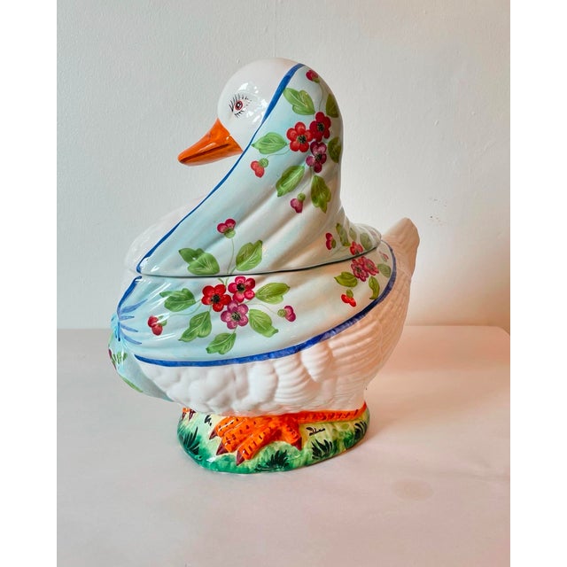 A fabulous vintage white goose tureen. She is wearing a colorful floral tied scarf. Made in Italy.